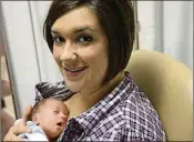  ??  ?? Kara Schooley sits with newborn daughter Amelia
in the neonatal intensive care unit.
Pregnant