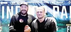  ?? — Reuters photo ?? Tyson Fury and Francesco Pianeta pose for a photograph during a press conference, ahead of their fight in Belfast on Saturday.