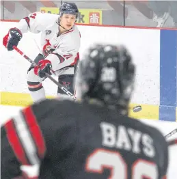  ?? ?? Valley Wildcats defenceman Aiden Clarke, of Port Williams, fires a shot towards the Truro Bearcats net during the first period of their March 20 playoff contest in Berwick.