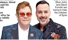  ??  ?? sUPPoRT: Elton John and David Furnish are trying to help the children of Syria