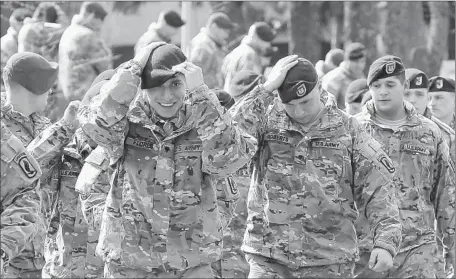  ?? Photograph­s by Sergey Dolzhenko
European Pressphoto Agency ?? U.S. TROOPS prepare for the opening ceremony of joint military exercises at the Yavoriv training center near Lviv in western Ukraine.