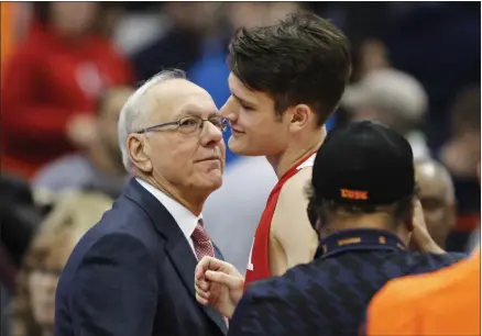  ?? NICK LISI — ASSOCIATED PRESS FILE ?? In a Nov. 10, 2017, photo, Syracuse head coach Jim Boeheim, left, talks with his son, Cornell’s Jimmy Boeheim, right, after the Orangemen’s 77-45 win at the Carrier Dome in Syracuse.