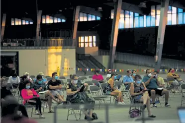  ?? Joseph Rushmore, NYTNS ?? People wait to file unemployme­nt insurance claims July 24, 2020, at the River Spirit Expo center in Tulsa, Okla.