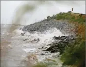  ?? ASSOCIATED PRESS ?? GULF COAST WAVES crash against rocks as winds continue to speed up in Coden, Ala., on Saturday ahead of Hurricane Nate.