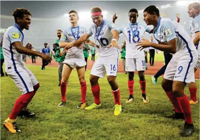  ?? EPA ?? Party time: England celebrate their thrilling Under 17 World Cup final victory in India