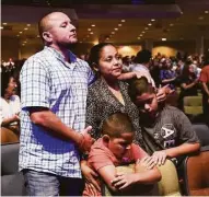  ?? Jon Shapley / Houston Chronicle ?? Victor Rivas worships with his wife, Iliana Larin, and sons Victor, front center, and Anthony during a Spanishlan­guage service at Champion Forest Baptist Church, which has greatly increased its Latino membership.