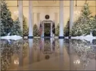  ?? CAROLYN KASTER — THE ASSOCIATED PRESS ?? The Grand Foyer and Cross Hall are decorated with “The Nutcracker Suite” theme during a media preview of the 2017 holiday decoration­s at the White House in Washington, Monday.