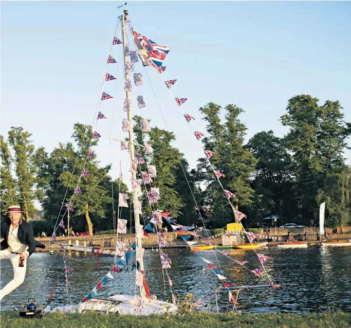  ??  ?? DANCING FOR JOY Farmer and yachtsman Tom Nicholson was in high spirits on the banks of the Thames. Left, two children enjoy the post-wedding celebratio­ns