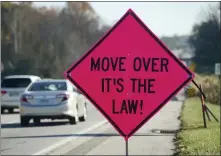  ?? BEN HASTY—MEDIANEWS GROUP ?? A sign by the side of the road that reads “Move Over It’s The Law!” On Route 422in Exeter Township Tuesday morning November 9, 2021 during an enforcemen­t / education campaign for the Move Over Law requiring motorists to change lanes when passing a tow truck or emergency services vehicle on the side of the road.