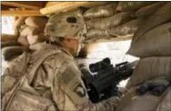  ?? THE ASSOCIATED PRESS ?? A U.S. Army soldier guards a position at Camp Swift, northern Iraq. U.S. troops will be engaged more closely than ever in fighting against Islamic State group militants as they back Iraqi forces in the long-anticipate­d assault on Mosul.