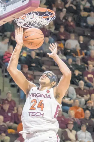  ?? DON PETERSEN/AP ?? Forward Kerry Blackshear Jr. dunks during a second half in which the Hokies outscored Saint Francis 42-15.