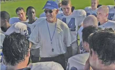  ?? STAFF PHOTO ?? Red Bank football coach Tom Weathers talks to players during a preseason practice in 2001. Weathers, who coached the Lions to more than 200 wins and an undefeated state championsh­ip run in 29 seasons leading the program, died Wednesday. He was 80.