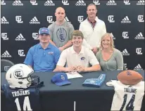  ?? / Jan Wright ?? Kyle and Kristy Hodson join their son, Hunter, as he signed to play football with Shorter University this past Thursday. Also on hand for the ceremony were Gordon Lee coaches Josh Groce and Todd Windham.