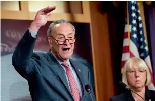  ?? AFP ?? Senate Minority Leader Chuck Schumer speaks as Senator Patty Murray looks on during a Press conference about the care bill on Capitol Hill in Washington. —