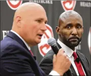  ?? CURTIS COMPTON/CCOMPTON@AJC.COM ?? Hawks general manager Travis Schlenk and head coach Lloyd Pierce hope the team will be allowed to continue some form of competitiv­e play during the long offseason.