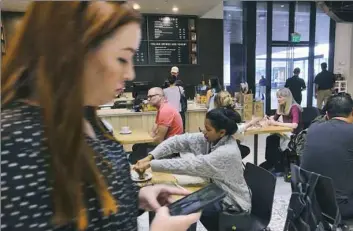  ?? Richard Vogel/Associated Press ?? Customers fill the LaVazza Cafe at Eataly in the Westfield Century City Mall in Los Angeles. Malls around the country are adding more dining options to attract patrons.