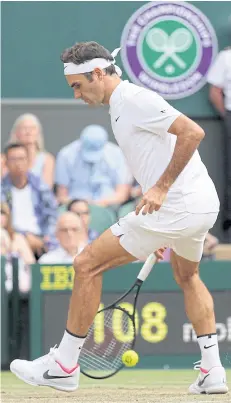  ?? AP ?? Roger Federer returns to Mischa Zverev during their match.