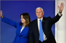  ?? Frederic J. Brown/AFP via Getty Images ?? Mike Pence and his wife Karen are pro-lifers who have used IVF.