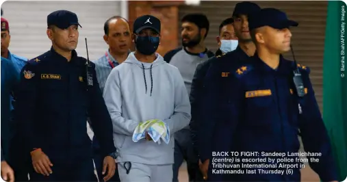  ?? ?? BACK TO FIGHT: Sandeep amichhane (centre) is escorte by police from the Tribh van Internatio­nal Airport in Kathmandu last hursday (6)