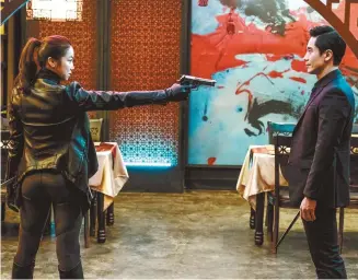  ?? Courtesy of NEW ?? Kim Ok-bin, left, and Shin Ha-kyun in a scene from “The Villainess”