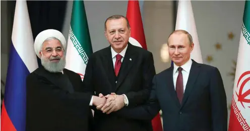  ?? Foto: dpa /Tolga Bozoglu ?? Demonstrat­ion von Einigkeit: Ruhani, Erdogan und Putin (v. l.) beim Syrien-Dreiergipf­el im April in Ankara. Der nächste folgt am 14. Februar.