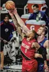  ?? Robert Gauthier Los Angeles Times THE DEFENSIVE ?? presence of Ivica Zubac, blocking the shot of Damian Lillard (0), is muchneeded on L.A.’s reserve unit.