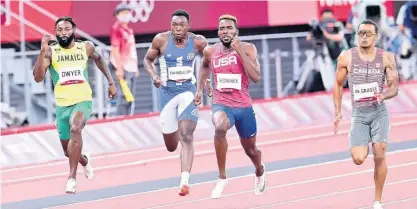  ?? GLADSTONE TAYLOR ?? Jamaica’s Rasheed Dwyer runs along with (from left) Liberia’s Joseph Fahnbulleh, the United States’ Kenneth Bednarek and Canada’s Andre De Grasse in the men’s 200 metres final at the Tokyo 2020 Olympics yesterday.