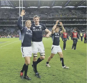  ??  ?? 0 Dan Parks, Al Kellock and Chris Cusiter celebrate victory over Ireland at Croke Park in 2010.