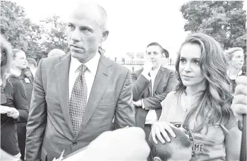  ?? — Reuters file photo ?? Avenatti (left) and actor Alyssa Milano attend a protest outside the White House in Washington, US, last month.