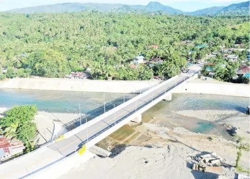  ?? PHOTOGRAPH COURTESY OF DPWH ?? A NEW bridge now links the communitie­s of Barangay Dibut and Barangay Dibalo via Barangay Real in San Luis town of Aurora province. The Department of Public Works and Highways continues to facilitate improved mobility in different parts of the country.