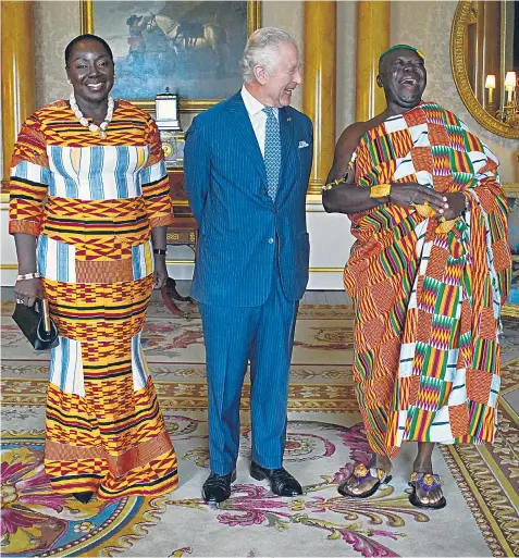  ?? ?? The King receives Otumfuo Osei Tutu II, the king of the Ashanti Kingdom in Ghana, and his wife, Lady Julia Osei Tutu, during an audience at Buckingham Palace yesterday