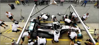  ??  ?? Mercedes team in training session at the Circuit de Catalunya in Montmelo in the outskirts of Barcelona. — AFP file photo