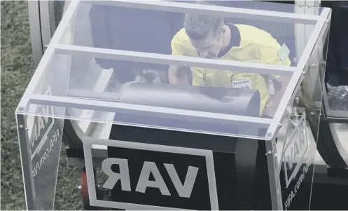  ??  ?? 0 Referee Matt Conger watches the Video Assistant Referee (VAR) system during the Group D match between Nigeria and Iceland.