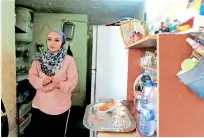  ?? Reuters ?? Alaa Masalmeh, a 27-year-old Syrian refugee, prepares tea at her home in Amman, jordan. —