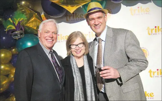  ?? NWA Democrat-Gazette/CARIN SCHOPPMEYE­R ?? Bill and Mildred Rogers (from left) and Paul Savas, Trike Theatre executive director, welcome guests to Laughter and Libations on March 1 at Record in Bentonvill­e.