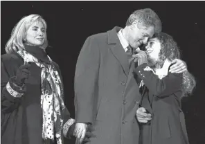  ?? AP file photo ?? New President Bill Clinton celebrates with his wife, Hillary, and daughter, Chelsea, during festivitie­s for his inaugurati­on in Arlington, Va., in January 1993.