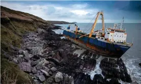  ?? Photograph: AFP Contributo­r#AFP/AFP via Getty Images ?? The abandoned cargo ship MV Alta ran aground near the village of Ballycotto­n in County Cork in February.