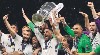  ?? Picture: AFP ?? KINGS OF EUROPE. Real Madrid captain Sergio Ramos lifts the Champions League trophy after they beat Juventus in the final at the Principali­ty Stadium in Cardiff on Saturday.