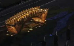  ?? XINHUA PIC ?? The ‘Silk Road and Golden Bridge’ structure in Beijing is lighted up at night in conjunctio­n with the Belt and Road Forum for Internatio­nal Cooperatio­n recently.