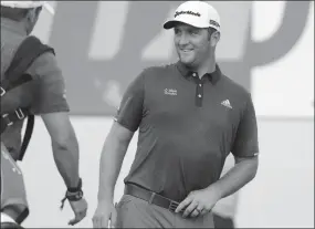  ?? The Associated Press ?? Spain’s Jon Rahm leaves the practice green at the St. Jude Invitation­al last Wednesday in Memphis,Tenn.