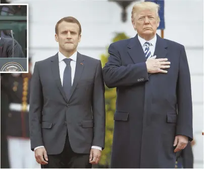  ?? AP PHOTOS ?? GREETINGS AND SALUTATION­S: French President Emmanuel Macron, above left, stands with President Trump yesterday. Macron, top left inset, kisses the hand of first lady Melania Trump.