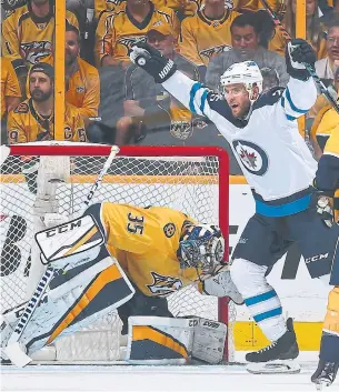  ?? FREDERICK BREEDON/GETTY IMAGES ?? Paul Stastny of the Jets celebrates his first of two, leading to a quick exit for goalie Pekka Rinne.