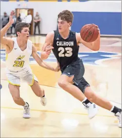  ?? / Tim Godbee ?? Calhoun’s Davis Allen drives past a North Murray defender in Saturday’s Region 6- AAA tournament finals matchup vs. North Murray.