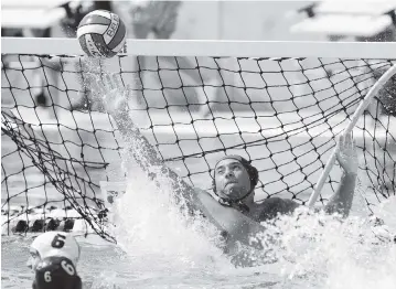  ?? ANDREW ULOZA FOR THE MIAMI HERALD ?? Belen Jesuit goalkeeper Bryan Weglarz makes a save during his team’s 17-13 victory against Orlando Dr. Phillips in the boys’ water polo state championsh­ip match at the Gian Zumpano Aquatic Center.