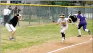  ?? MARK HUMPHREY ENTERPRISE-LEADER ?? Prairie Grove softball coach Dave Torres (left) sends Charity Stearman home after a cutoff throw went past third into the fence. Stearman scored the Lady Tigers’ fifth run to even the score in the bottom of the seventh. Prairie Grove rallied to win 6-5 in the 4A-1 Conference softball opener on Tuesday, March 30.