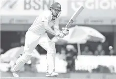  ??  ?? Australian batsman Shaun Marsh plays a shot during the fifth day of the third cricket Test match between India and Australia at the Jharkhand State Cricket Associatio­n (JSCA) Stadium complex in Ranchi. - AFP photo