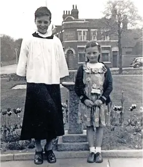  ?? ?? St Thomas’ church grounds with the Marquis of Granby pub to the rear in 1957. The young girl with Allan is his sister Ann Cooper. He was aged 14 she was nine.