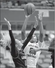  ?? Arkansas Democrat-Gazette/THOMAS METTHE ?? is fouled as she shoots by Louisiana-Lafayette’s Kendall Bess (left) during the fourth quarter of the Trojans’ 62-48 victory over the Ragin’ Cajuns on Saturday at the Jack Stephens Center. DeGray tied a career high with 25 points and grabbed 11 rebounds in the victory.