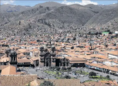  ?? MARTIN MEJIA/THE ASSOCIATED PRESS ?? Cuzco’s main plaza, photograph­ed May 2, 2018, dominates the Peruvian city. Cuzco was the capital of the ancient Inca Empire, and from the 16th to 18th centuries it became an epicentre for Catholic-themed art under Spanish colonizers.