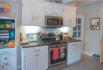  ??  ?? The kitchen is brand new and features painted cabinetry and granite counter tops.